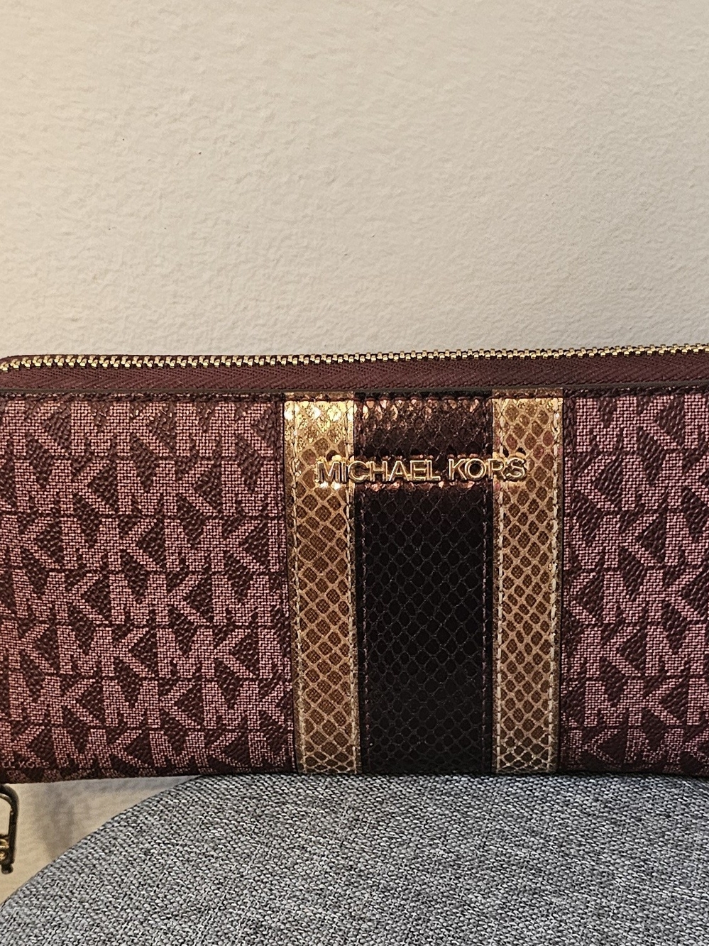 MICHAEL KORS Plum Logo Wristlet with Gold Trim